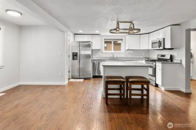 Eat in nook and a walk in pantry to the left of the refrigerator.
