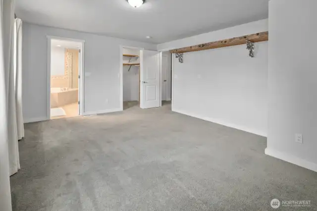 Walk in closet next to en-suite entrance.