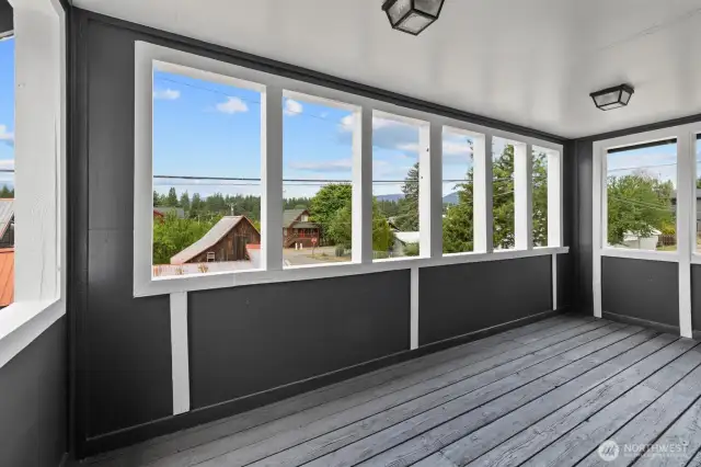 Step out to the outside covered porch with moutain views.
