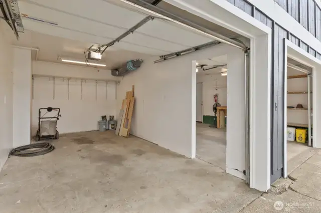 Garage bay 2 has access to bay 1 and MORE storage under home.