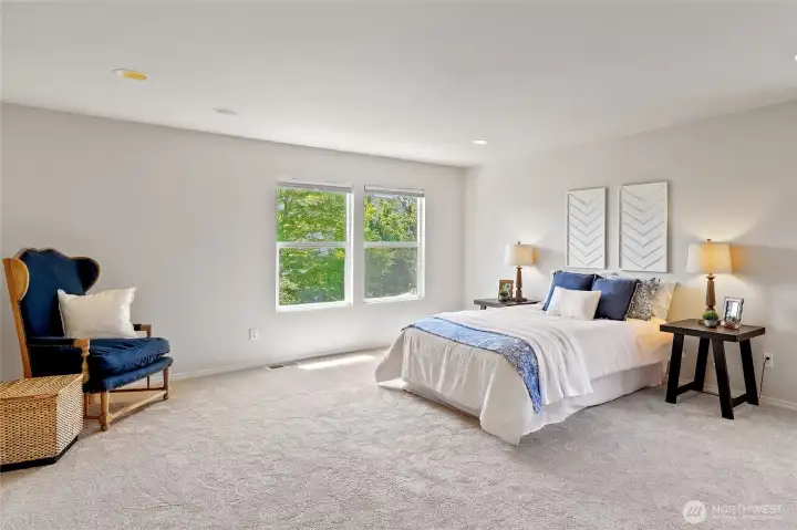 Primary bedroom overlooks the backyard