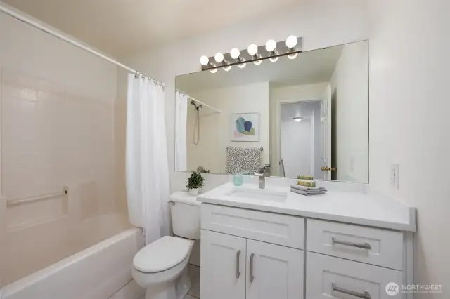 Second bathroom with shower / tub combo. New vanity, counter top and paint