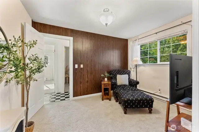 Versatile bonus room with natural light, cozy carpet, and flexible use for office, media, or guest space.