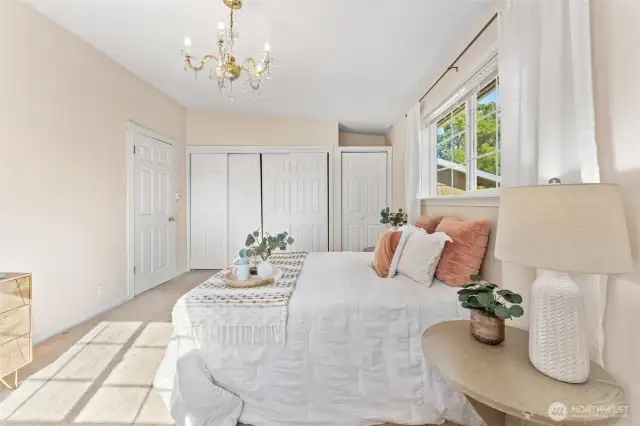 Main floor bedroom 3 (Primary). Spacious primary suite with multiple closets, abundant natural light, and plenty of room for a full bedroom set.