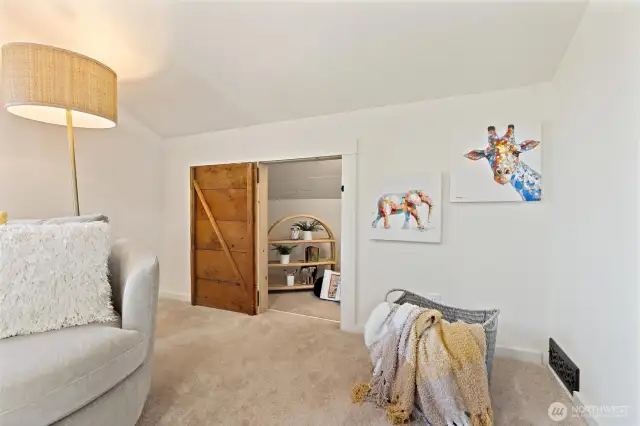 Charming bonus alcove off bedroom #4, currently styled as a reading nook with endless possibilities.