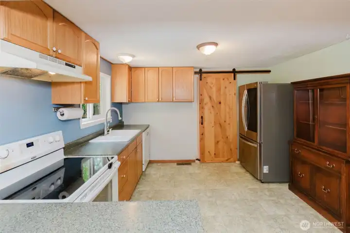 Barn door is closed to the utility room