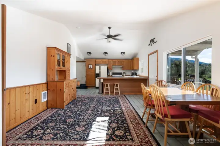 Pine wainscoting accents the walls in dining area.