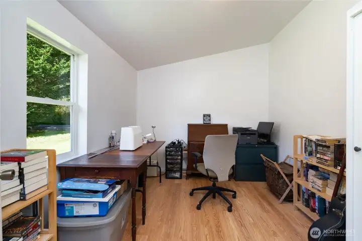 Bedroom 1, with laminate flooring.