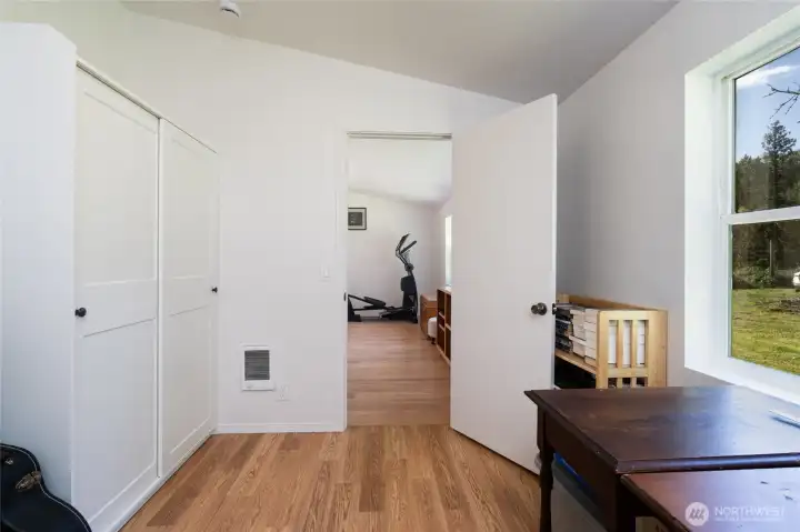 Bedroom 1, wall closet unit to the left.