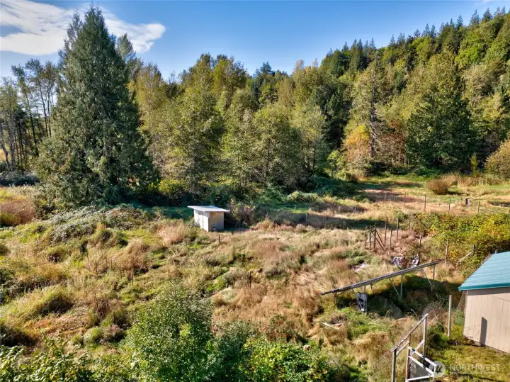 This area is fenced in and served as a garden space in years past.