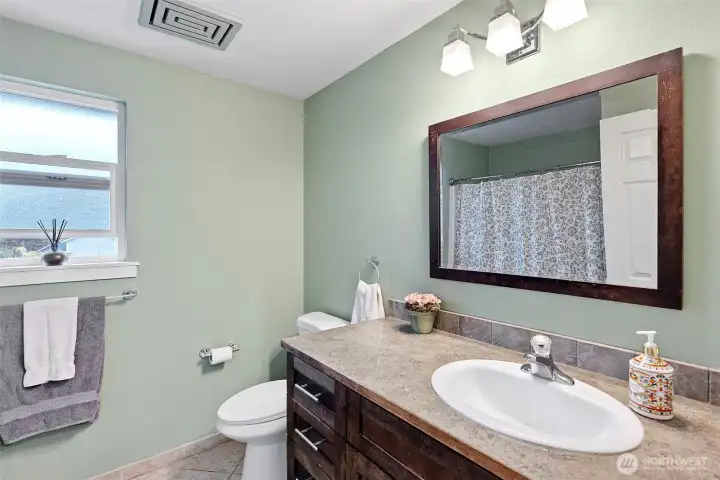 Main upstairs bath with full tub/shower  Its good size too!