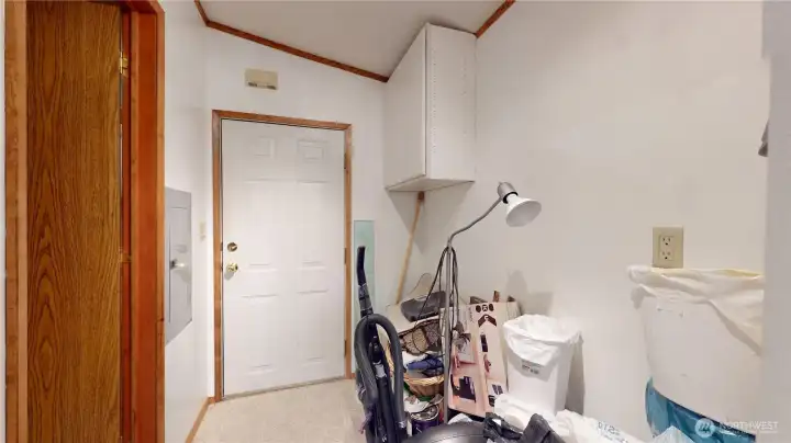 Mudroom next to the garage. This home has lots of storage!