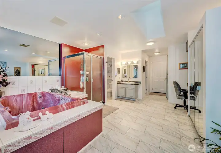 Another View Tiled Of Primary Bathroom. Another 1/2 Bathroom On Left..