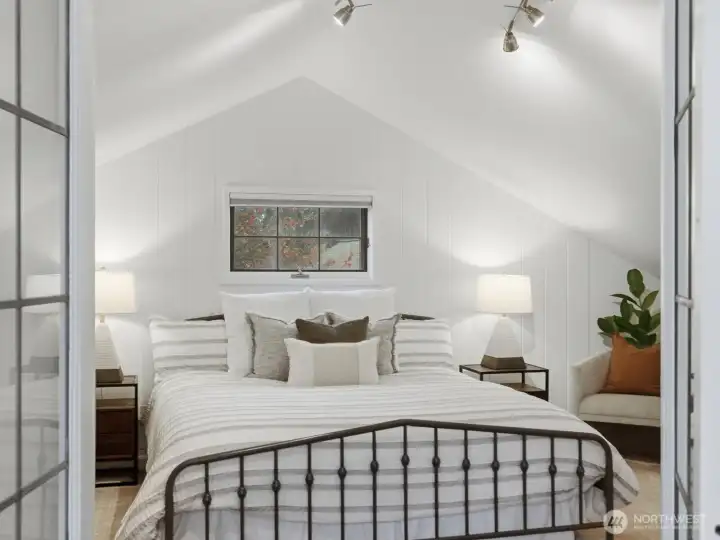 French doors lead to bedroom two (upper floor)