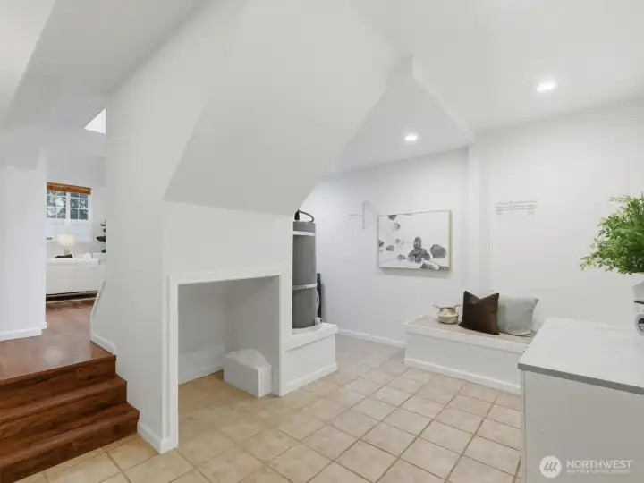 Large open utility/flex space at the bottom of the stairs