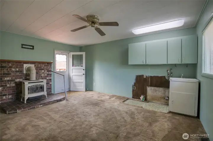 Family room with gas stove and laundry