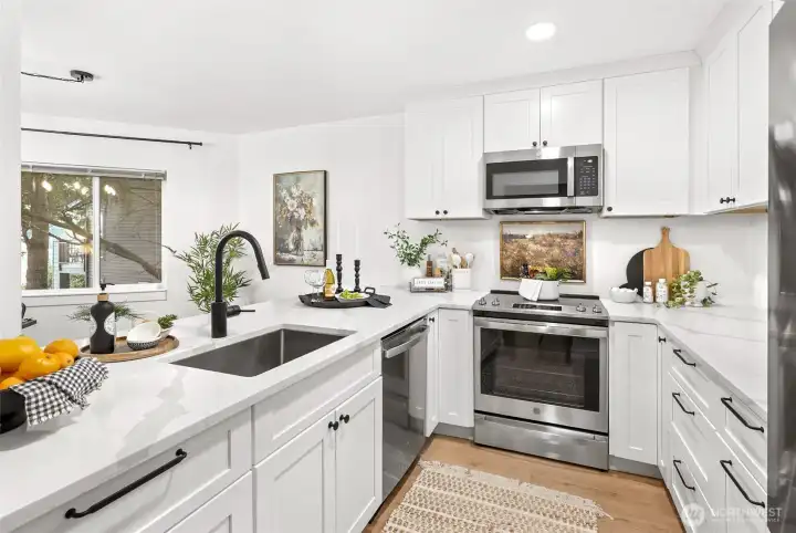 Remodeled kitchen with quartz countertops and soft close cabinets.