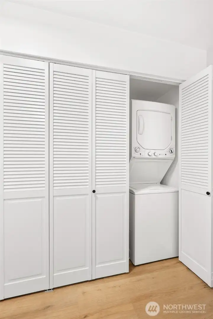 Washer/dryer in unit with a TON of extra storage.