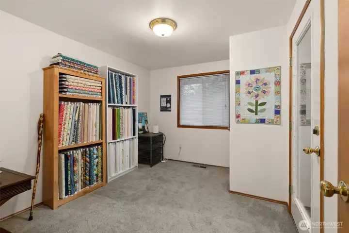Main Floor Bedroom with door to deck