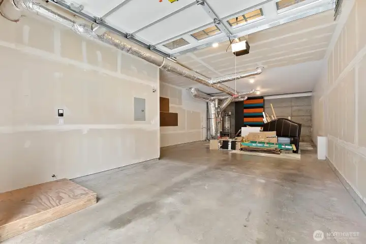 2 car tandem garage with large workshop area and panels to hide shelving at back if you desire to add shelves.