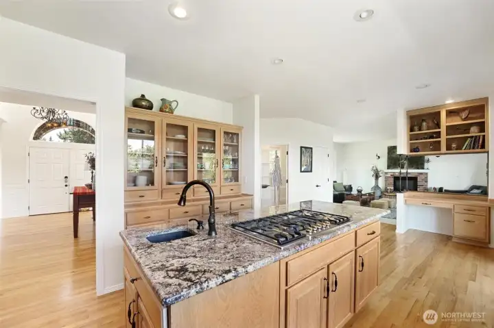Gourmet kitchen with granite countertops, space to entertain and a dedicated workspace.