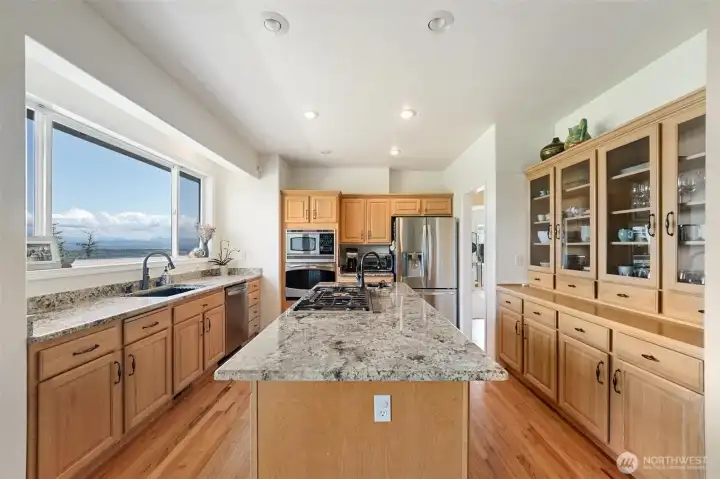 Spacious kitchen with a view!  Stainless steel appliances and access to the expansive deck.