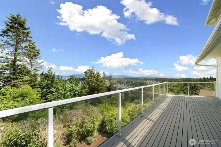 The expansive deck runs the length of the house, has access from the kitchen and looks out onto the incredible view.