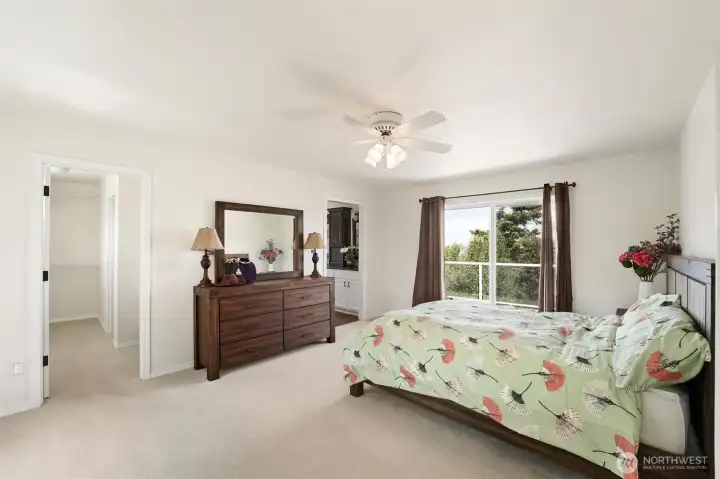 The spacious primary bedroom has its own private deck, full ensuite and large walk-in closet.
