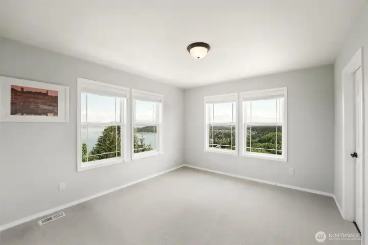 The second bedroom has incredible views and access to its own bathroom and a shared shower with the third bedroom.