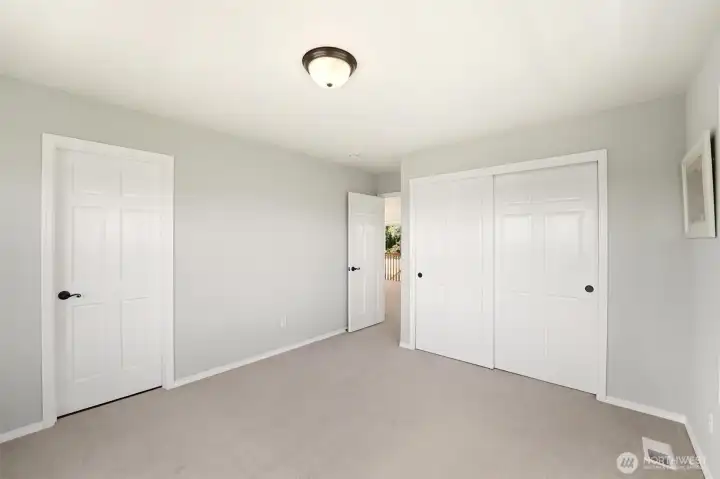 The spacious second bedroom.