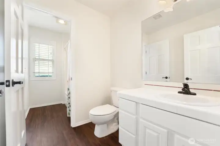 The second bedroom has its own private bathroom and shared shower room with the third bedroom.