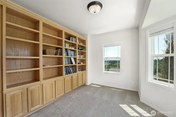 The main floor dedicated office space is complete with built in bookshelves.