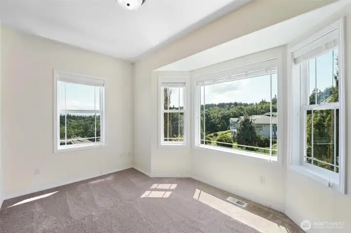 The spacious and bright office on the main floor has lovely views.