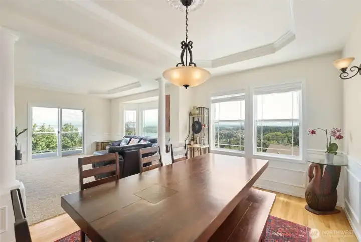 The luxurious dining room lets in the natural light and views.