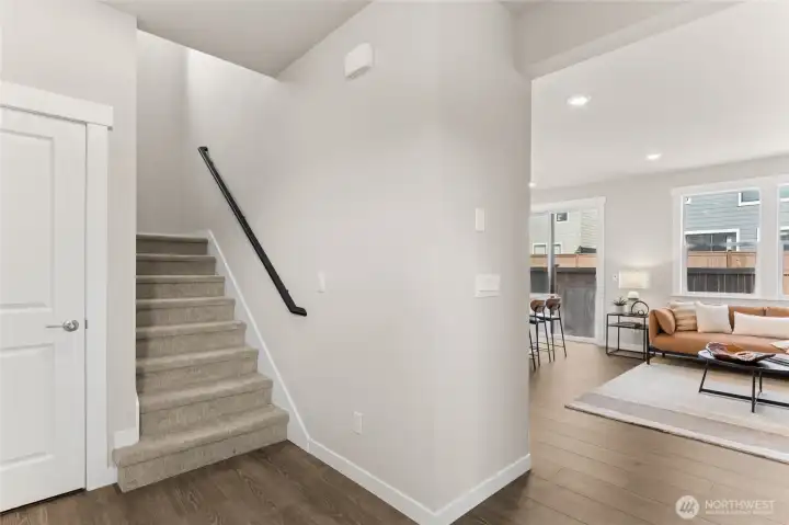 Inviting entry from garage with stairway access and seamless flow into the main living area.