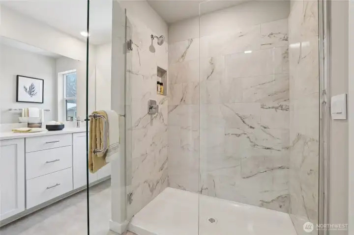 Primary shower ~ showing stage home in the community with the same plan.