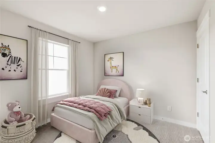 One of the three bedrooms upstairs, staged from a different home of the same plan.