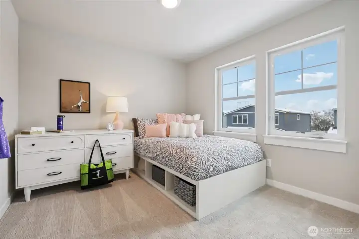 Secondary bedroom - showing stage home in the community with the same plan.