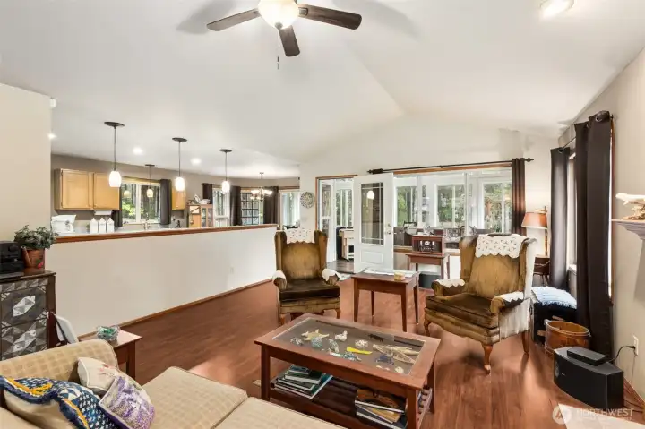 Here's a view of the family room with vaulted ceiling, kitchen to the left and straight ahead through the French door is the recently added sun room.