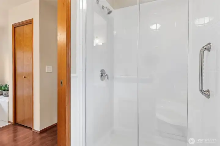Primary Bathroom; the new shower & toilet have a pocket door that keeps things separate & private.