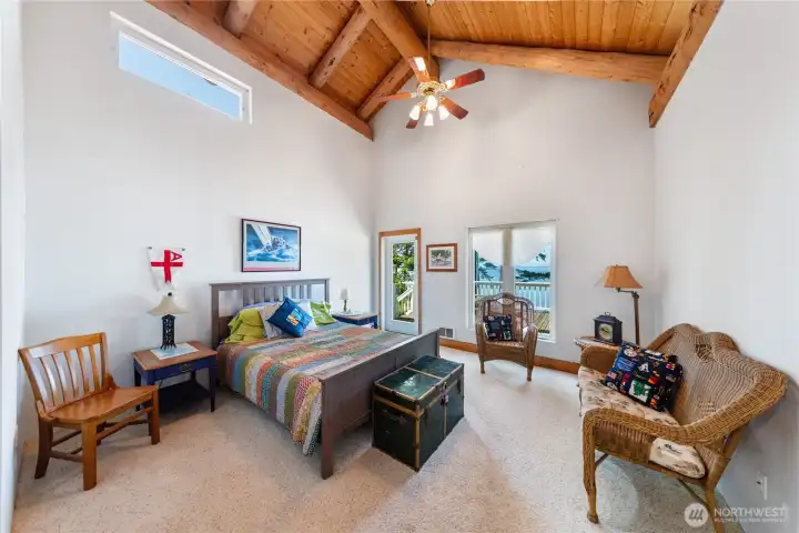 Upper-level bedroom with deck access.