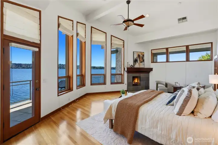 Luxury Primary Suite with ceiling fan & private view deck.
