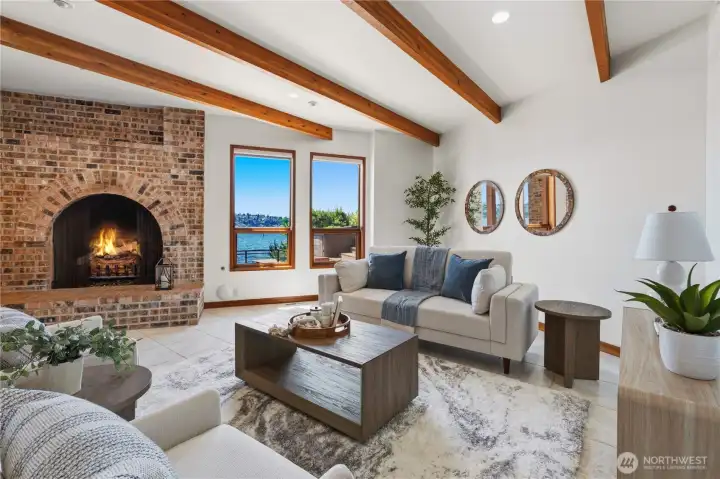 Spacious recreation room at lower level with fireplace and direct access to water and dock