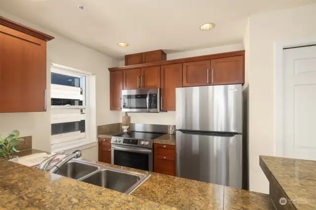 Brand new stainless steel appliances in the kitchen including the dishwasher not pictured. Plenty of counter space and storage with a full size pantry.