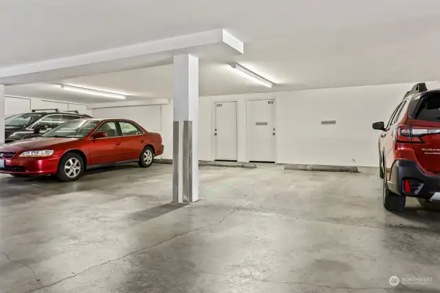2 car spaces in common garage parking with a storage room.