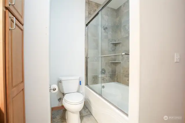 Guest bathroom with full tub