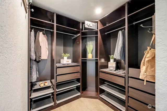 Step into luxury with this custom-designed walk-in closet, meticulously crafted to elevate your daily routine.
