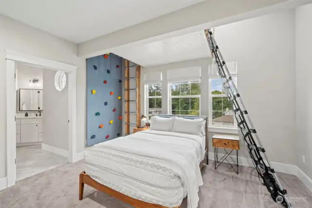 4th bedroom with a rock wall which can be removed, which leads up to a loft bed above the main bed. Fun kid room!!