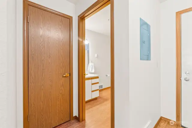 Under stair storage closet on left.