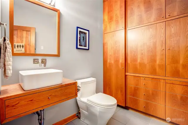 Oversized powder room with extra storage.